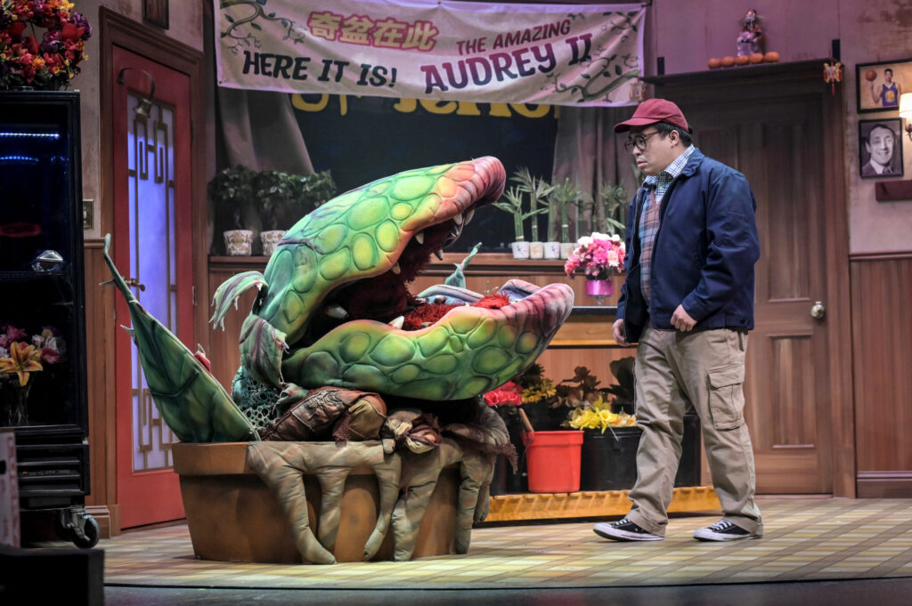 Phil Wong with puppet voiced by Katrina Lauren McGraw, manipulated by Brandon Leland, designed by Matthew McAvene Creations / Photo Kevin Berne